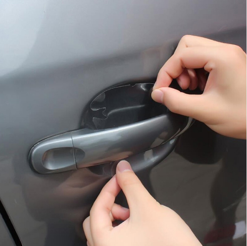 Applying clear film inside a car door handle cup