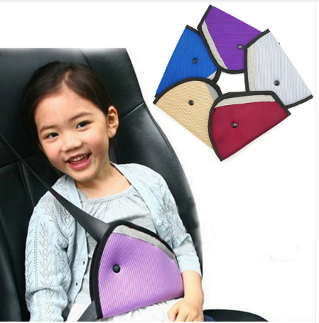 Child wearing a seat belt with the adjuster